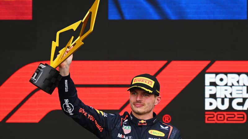 Max Verstappen holds winning trophy from 2023 Canadian Grand Prix